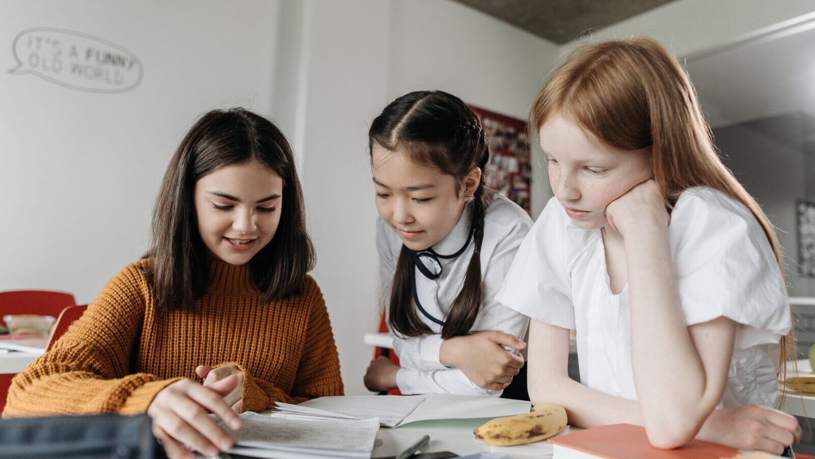 Three children work together on a project